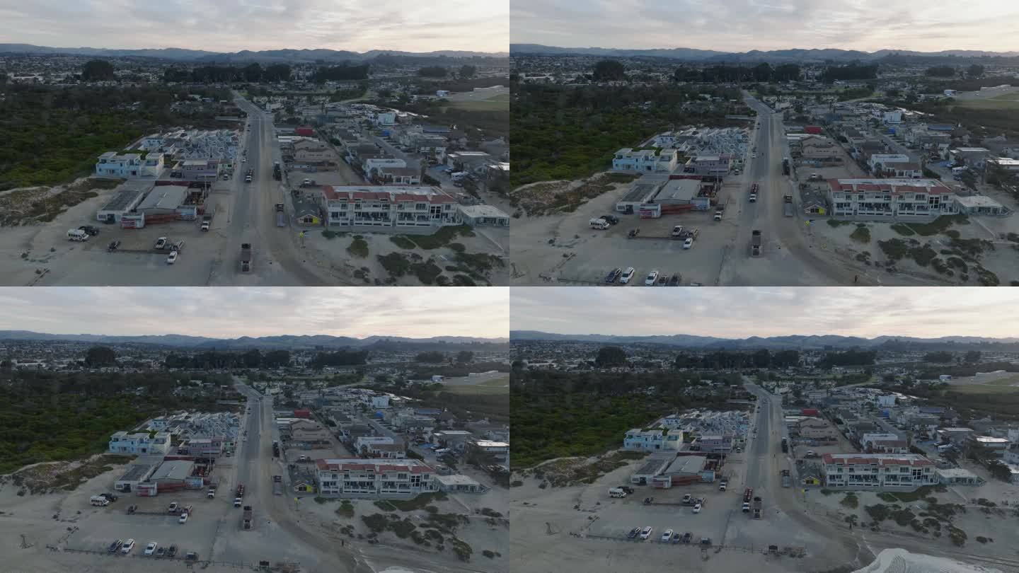 空中无人机拍摄的皮斯莫海滩加州机场和城镇在日出