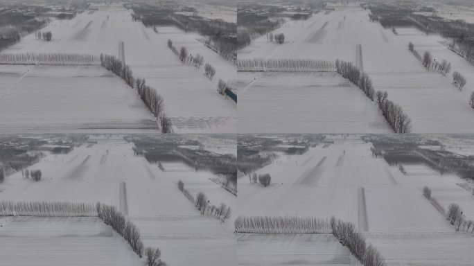 冬季农村平原地区荒野庄稼地雪景航拍
