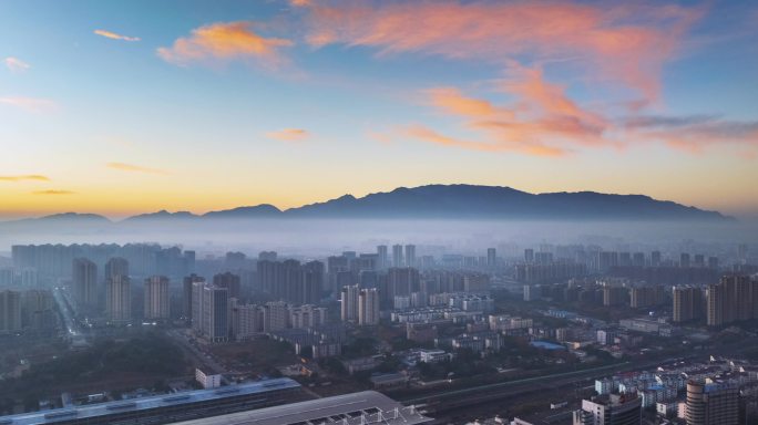 朝霞天空下的九江城景航拍延时