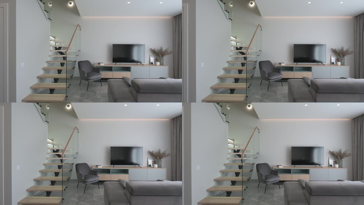 宽敞明亮的房间，斯堪的纳维亚风格，时尚的木制楼梯与玻璃元素和灰色沙发