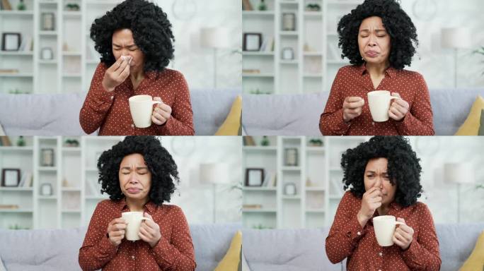 关闭了。生病的非裔美国女性坐在家里客厅的沙发上咳嗽。她得了感冒、病毒、支气管炎或流感