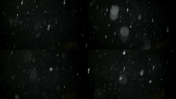 现实的降雪背景孤立的黑色背景。Alpha通道，无缝循环背景