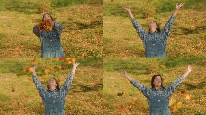 身穿蓝格子衬衫的年轻女子将枫叶扔过头顶(特写)。秋天的心情。季节变化。自然的户外