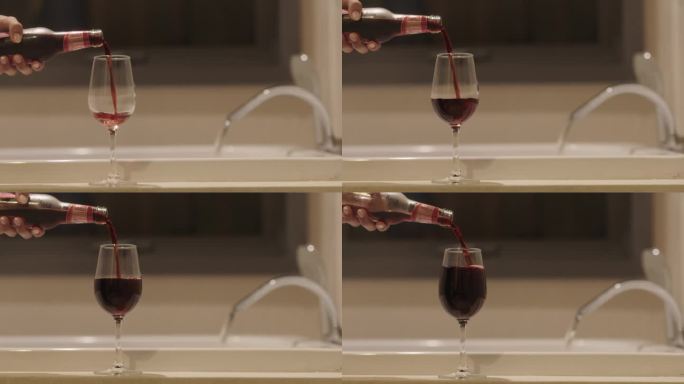红酒正被倒进玻璃杯里