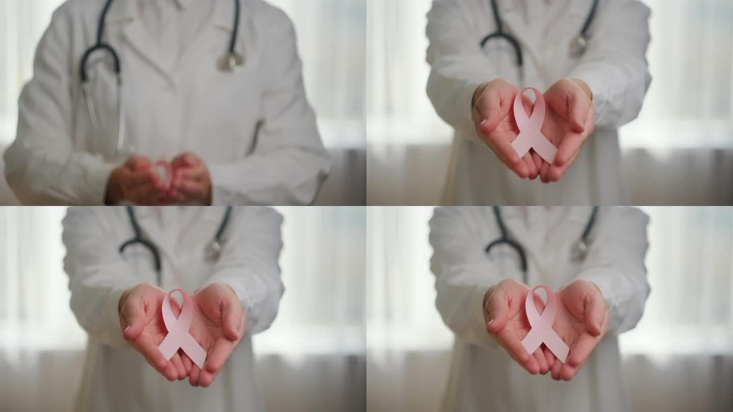 十月乳腺癌宣传月。在医院里，女医生手持粉红丝带，支持人们的生命和疾病。全国癌症幸存者月，母亲和世界癌