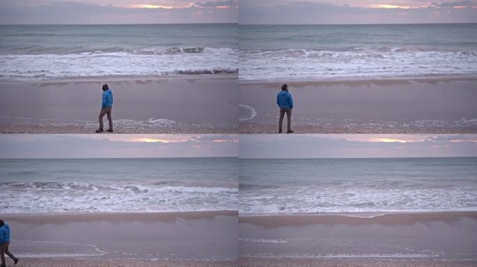 日出时在海边散步的人。本空间