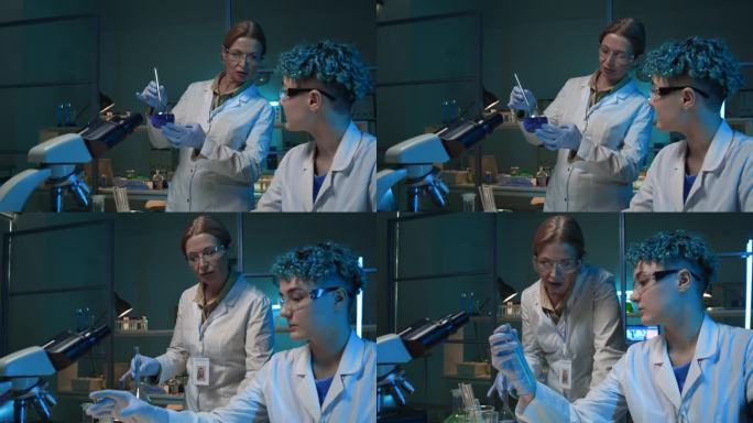 两位化学家在实验室讨论液体样品