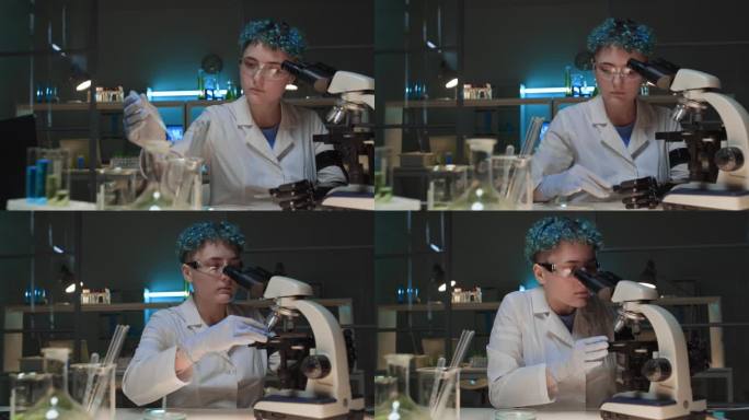 女研究员在实验室显微镜下研究液体