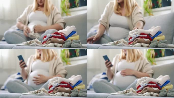 孕妇在客厅沙发上叠婴儿衣服