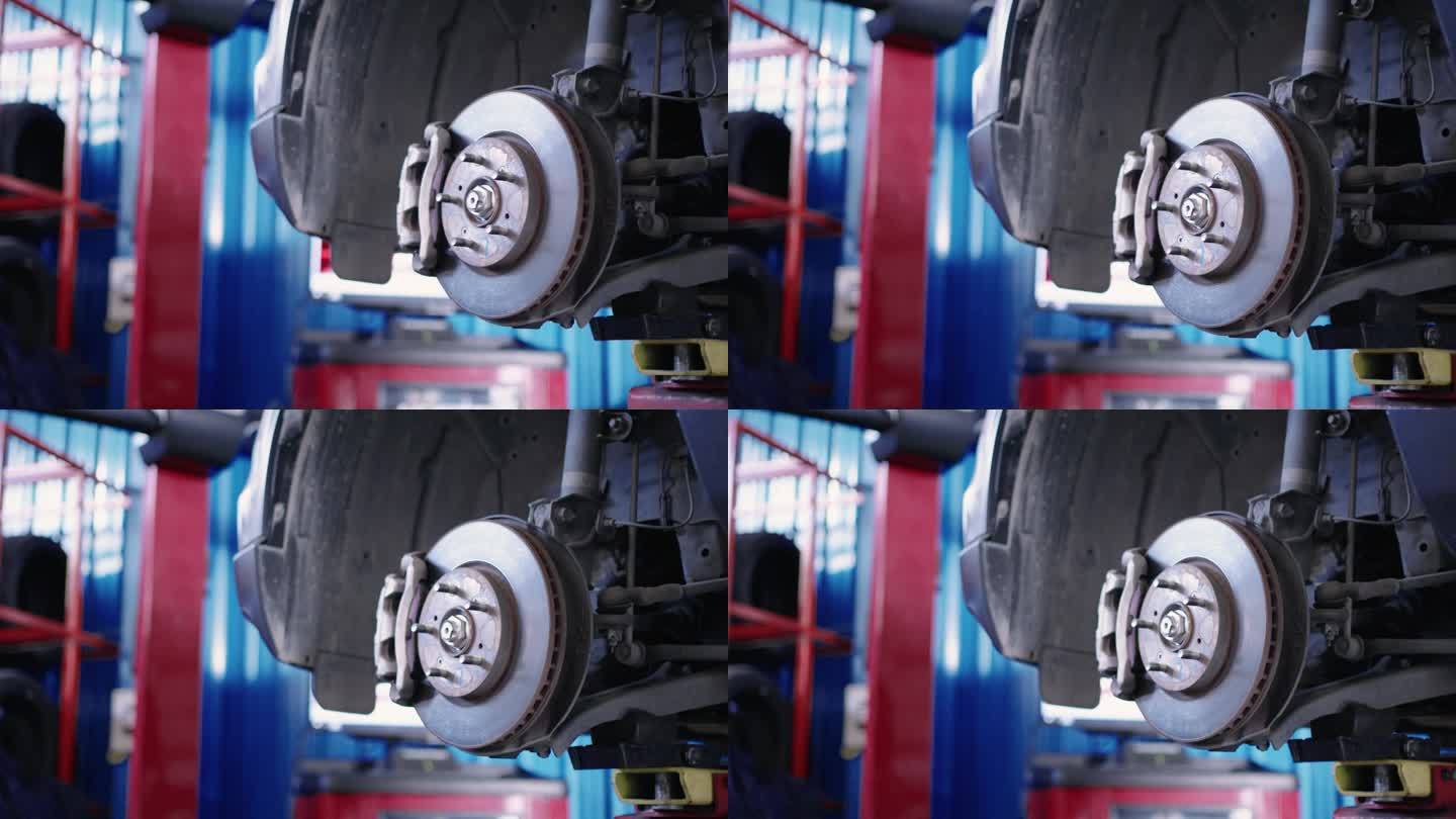 盘式制动器的车辆在维修过程中更换新轮胎。
