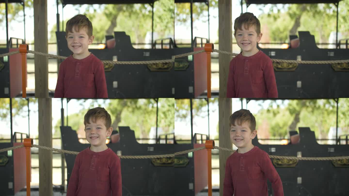 快乐微笑的男孩在万圣节南瓜园在秋天，秋天的季节