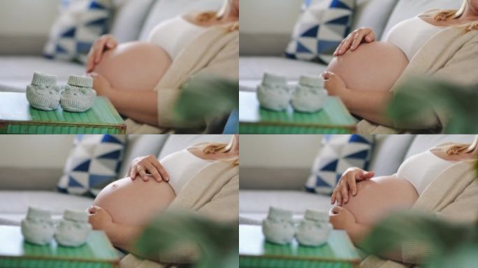 近距离拍摄孕妇在婴儿靴后按摩肚子