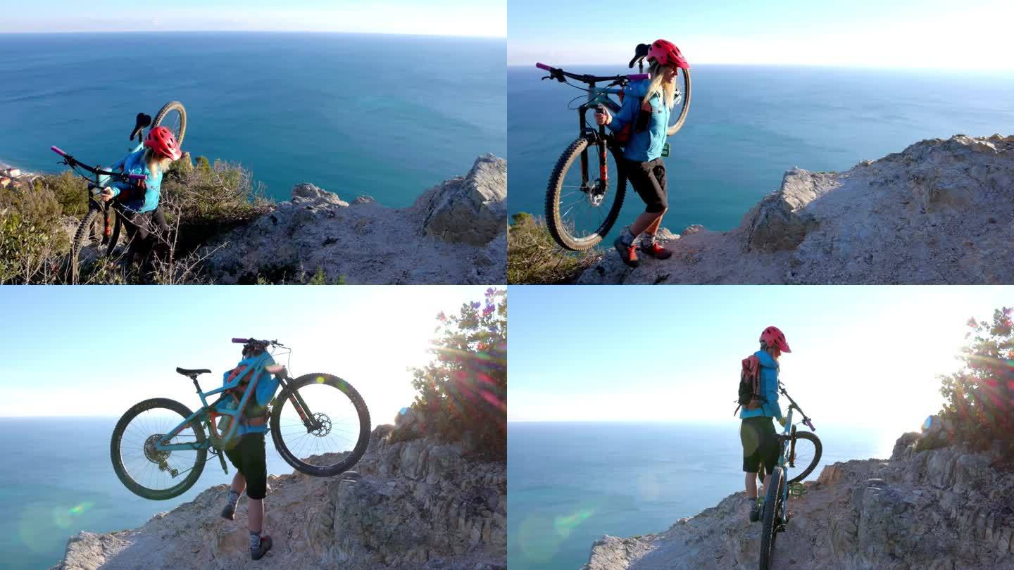 年轻的女自行车手骑着自行车越过崎岖的山脊