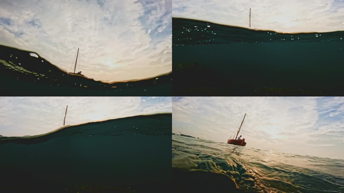 夕阳下，一名男子伸出手帮助一名女子爬上一艘漂浮在海湾上的木船
