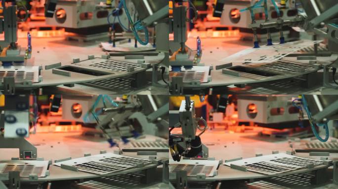 自动化的机器。工业工厂。先进的机器人在自动装配线上放置零件。