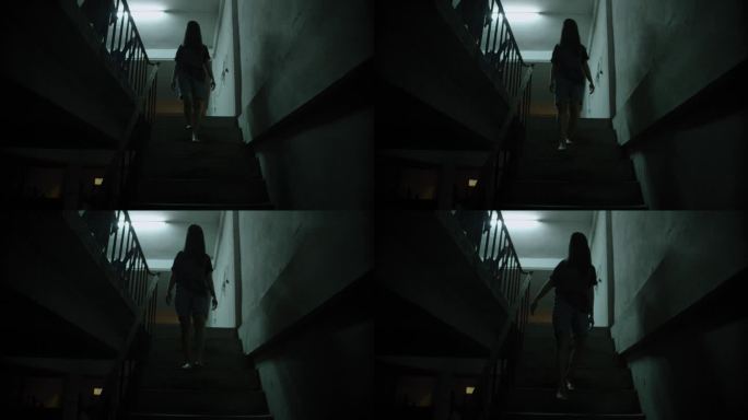 恐怖场景一个神秘可怕的亚洲鬼女人令人毛骨悚然的有头发遮住脸坐在楼梯上在废弃的房子的背景黑暗场景电影在