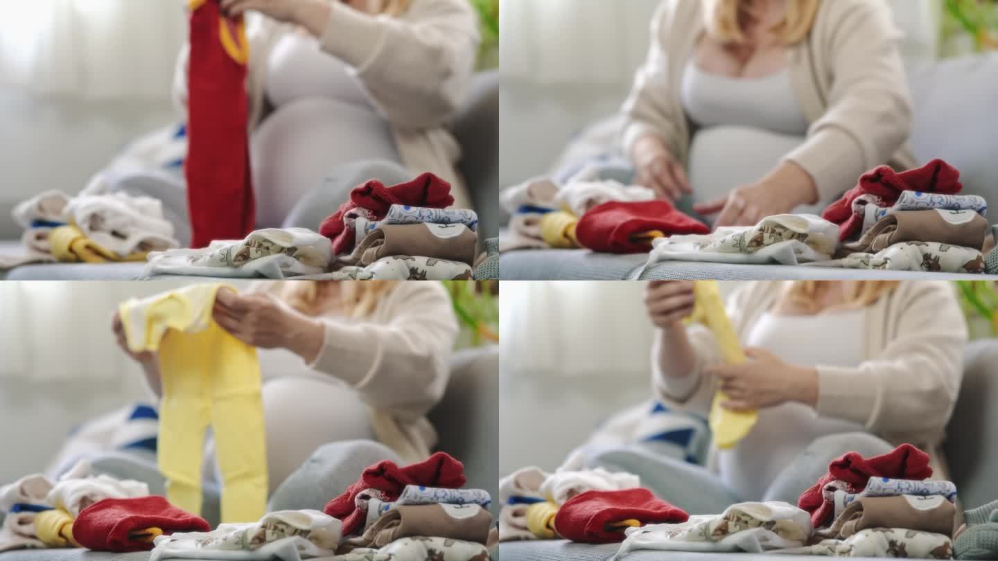 孕妇在客厅沙发上看婴儿服装