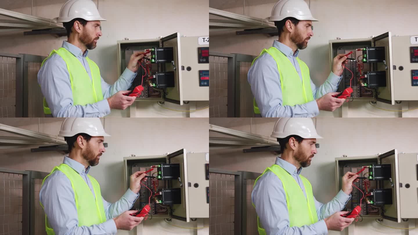 电工使用电气测试仪检查变电站配电盘的功能。技术员检查工厂技术区域内传输线上的电压。