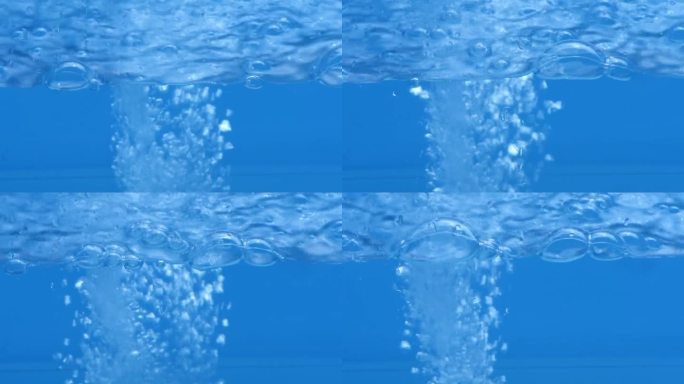 蓝水在水面上泛起涟漪。离焦模糊透明黑白彩色清晰平静水面纹理飞溅和泡沫。水波与闪亮的图案纹理背景。