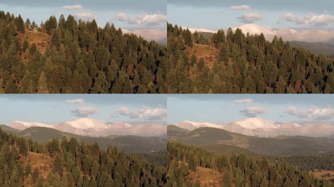 山峰上的第一场雪，蓝天山埃文斯空中无人机电影揭示从科罗拉多州长荣爱达荷州斯普林斯莫里森丹佛日出第一光