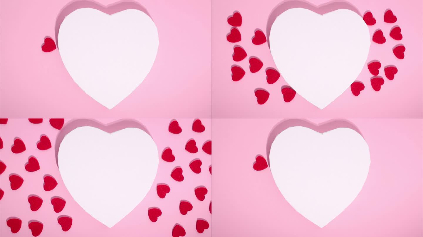 心脏的定格动画。副本的空间。爱的概念，情人节。在粉红色的背景上，许多小红心围绕着大白心移动。