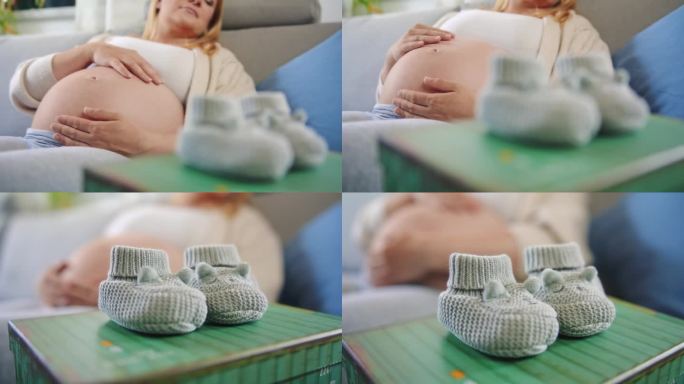 孕妇放松，在沙发上揉宝宝肚子