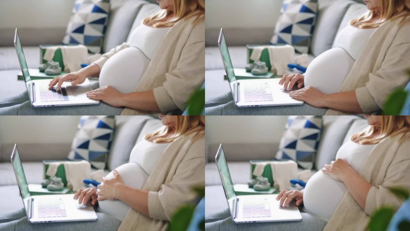 孕妇在家用笔记本电脑在客厅沙发上工作