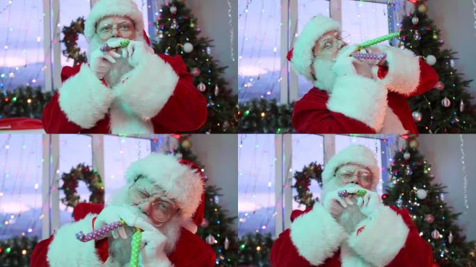 有趣的圣诞老人同时吹响两个派对号角，在圣诞派对上开玩笑，玩得很开心
