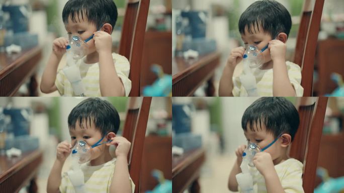 亚洲小男孩在家用雾化器治疗感冒-儿科保健概念。