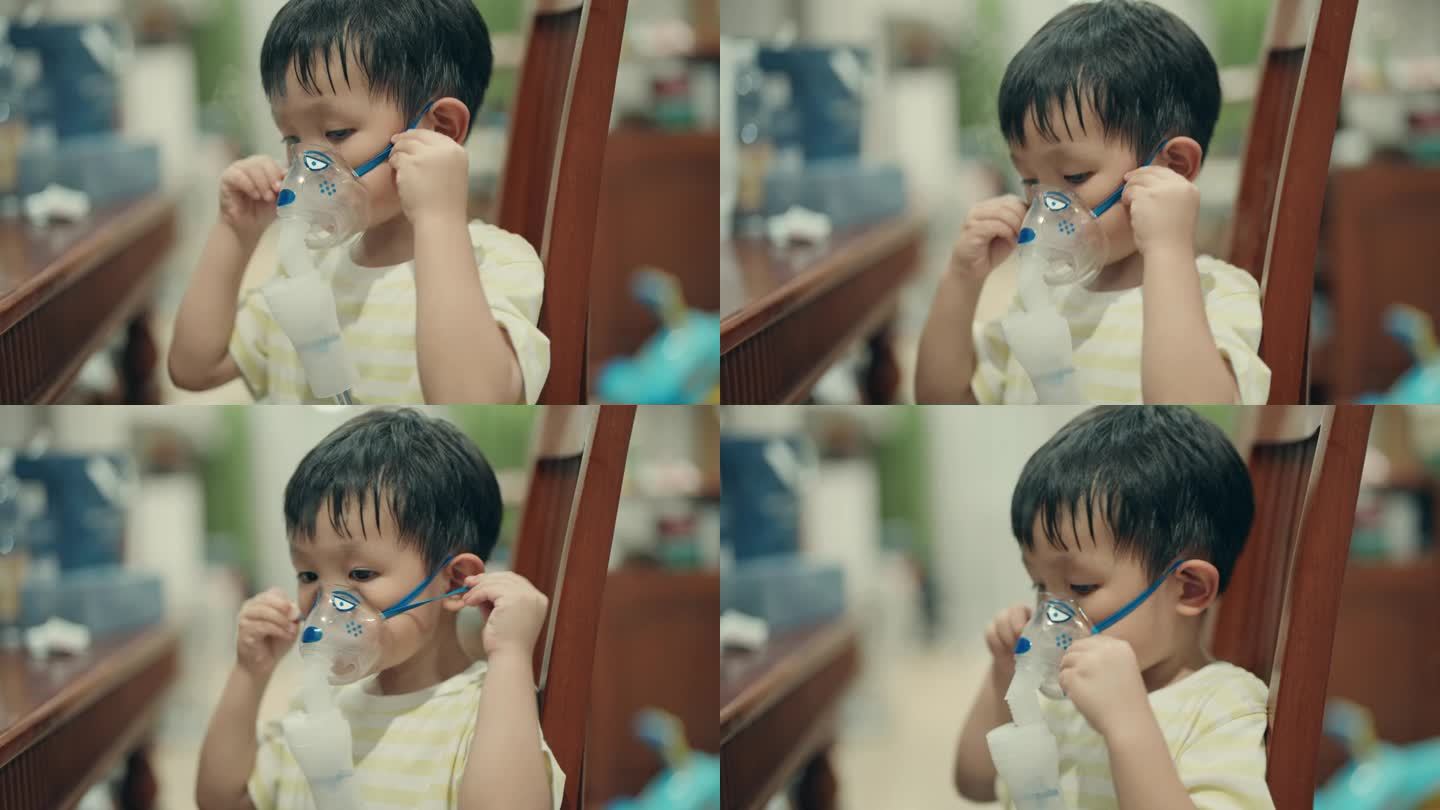 亚洲小男孩在家用雾化器治疗感冒-儿科保健概念。