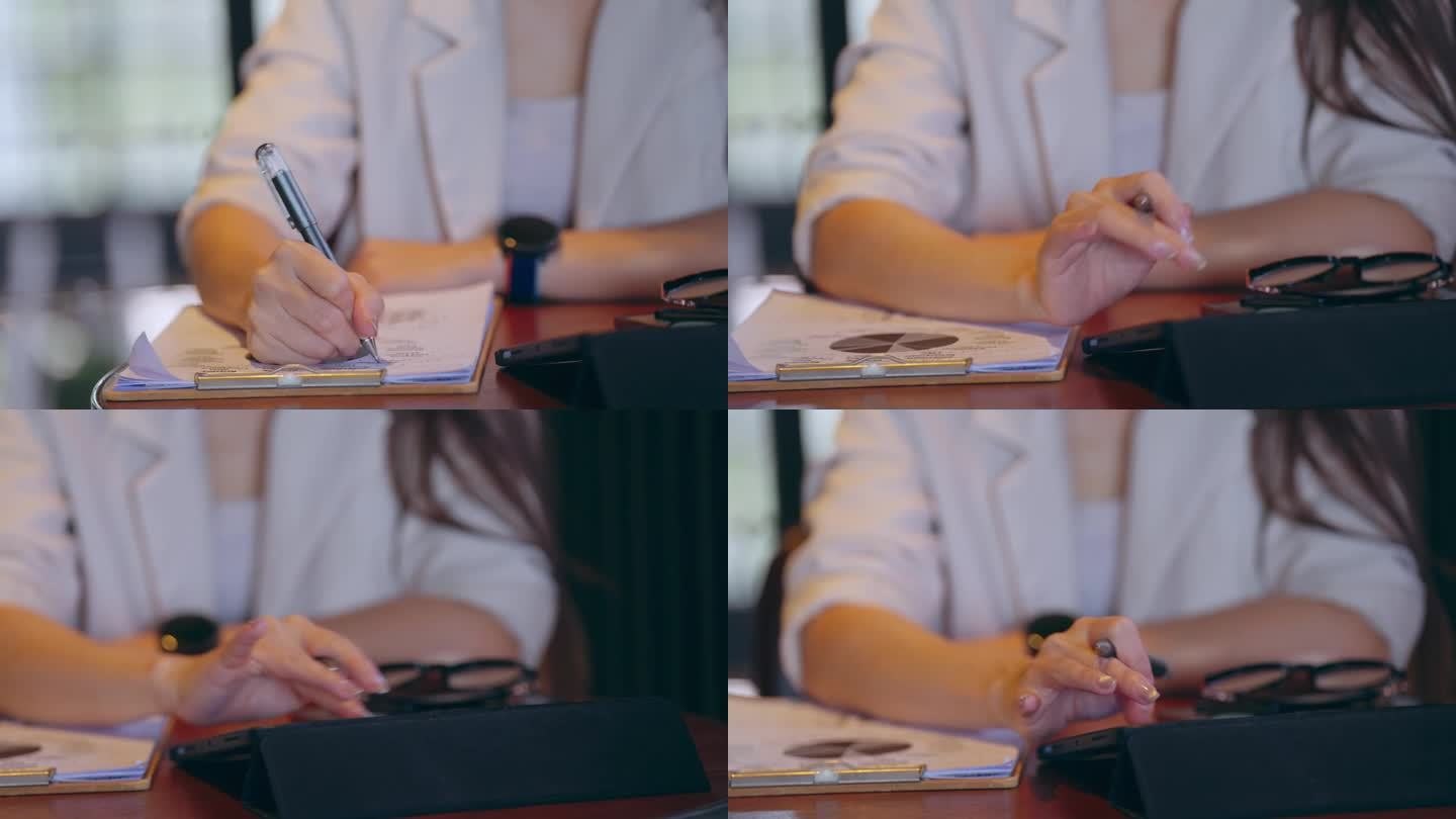 女性在法庭上做笔记的手特写，律师在桌子办公室工作。