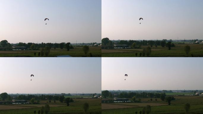 滑翔伞降落在机场在黄金时间日落。空中上升投篮