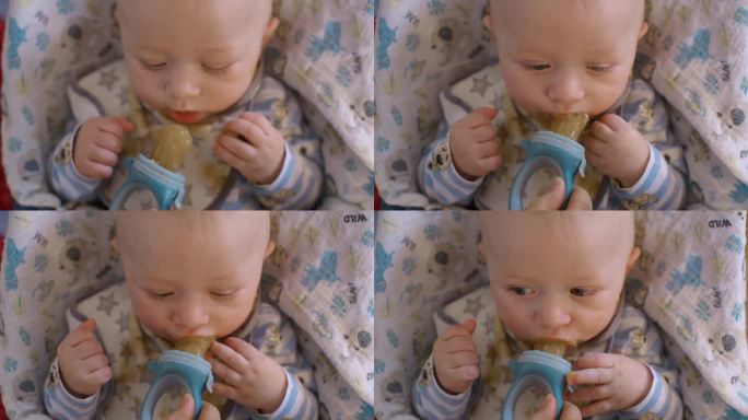 正上方的照片是妈妈在家给小男孩喂奶嘴里的浆糊