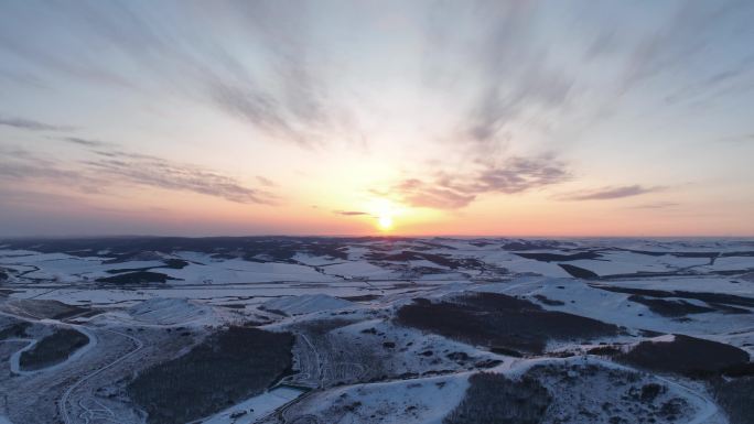 丘陵山地雪景日暮航拍延时