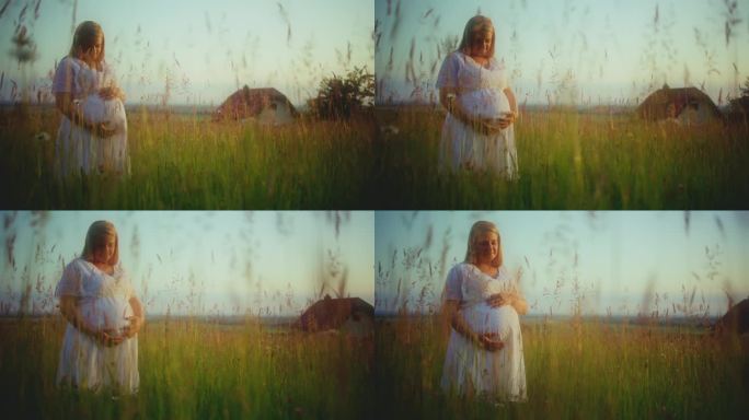 一名身着白衣的孕妇在农村按摩婴儿肚子