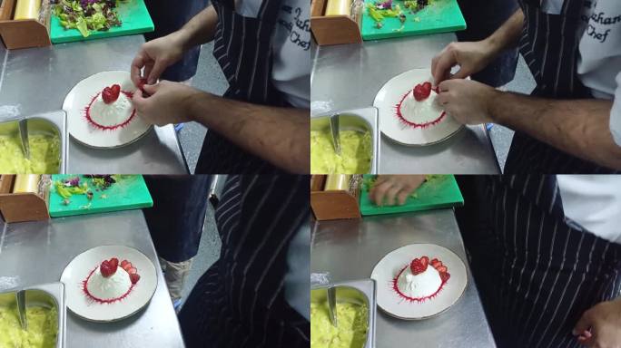 糕点设计师大厨正在制作一款草莓馅的多层蛋糕