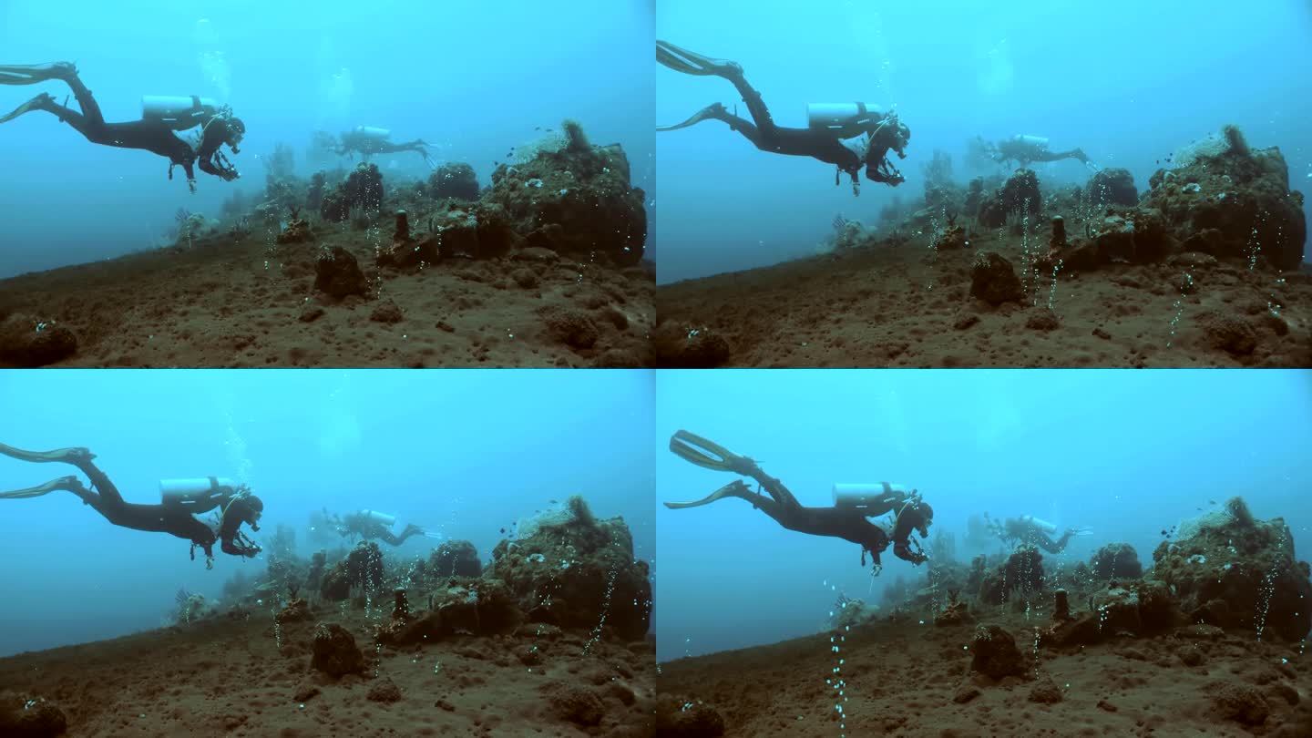 潜水者探索珊瑚礁
