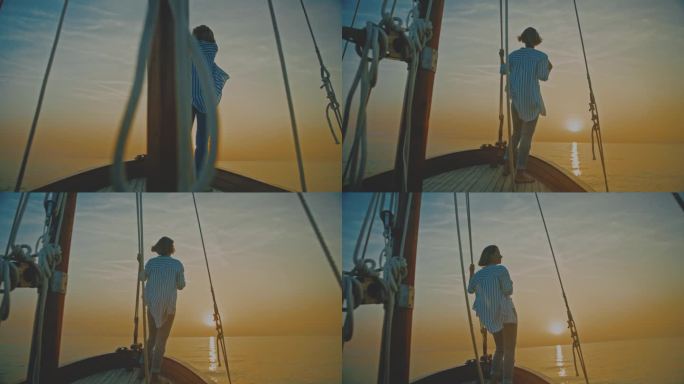 SLO MO航行宁静:一个女人在帆船上欣赏日落