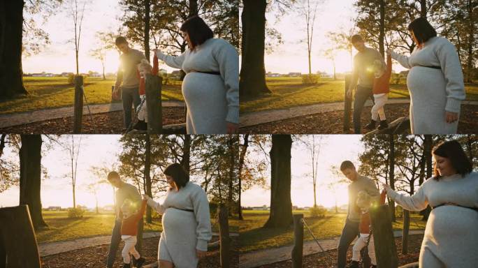日落时分，一对慈爱的父母牵着女儿的手在公园的秋千上散步