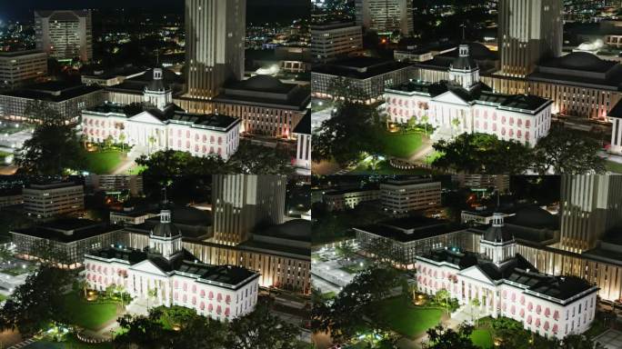 佛罗里达州塔拉哈西州议会大厦的夜景。航拍镜头倾斜向下平移轨道摄像机运动。