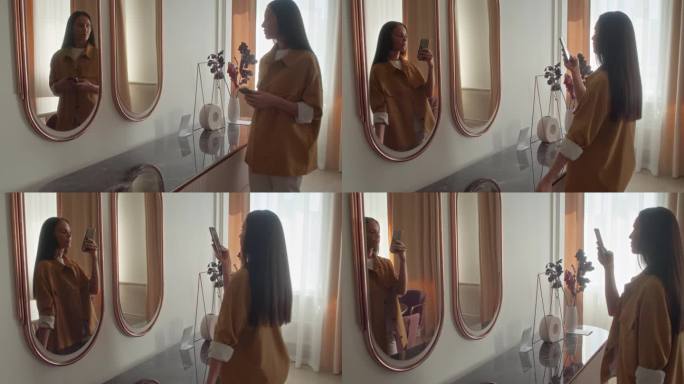 女人在镜子的倒影中拍照