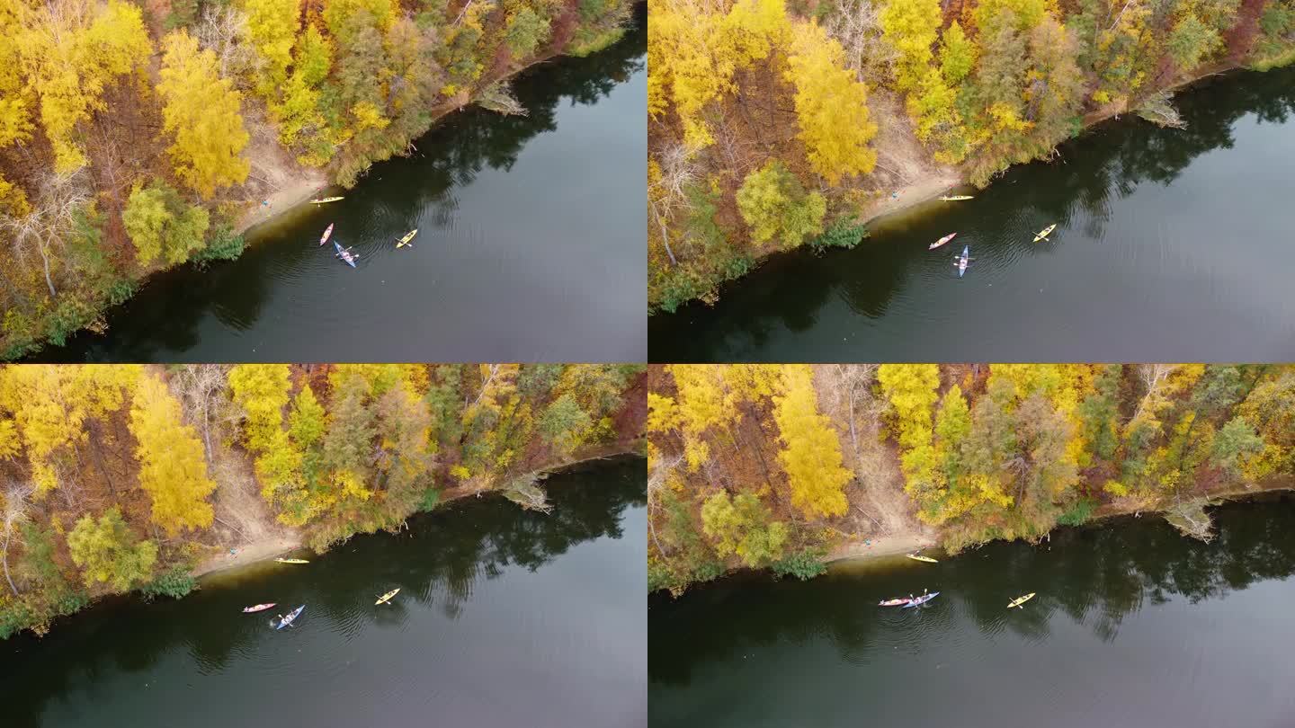 秋天的天空在河上划出弧线，有皮艇和森林