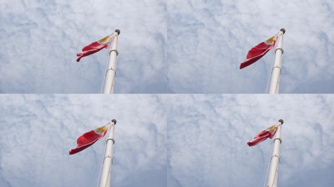 菲律宾国旗飘向左边，镜头拉近，露出棉花般的云朵。