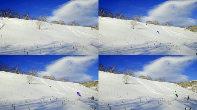 双人滑雪从高处滑下