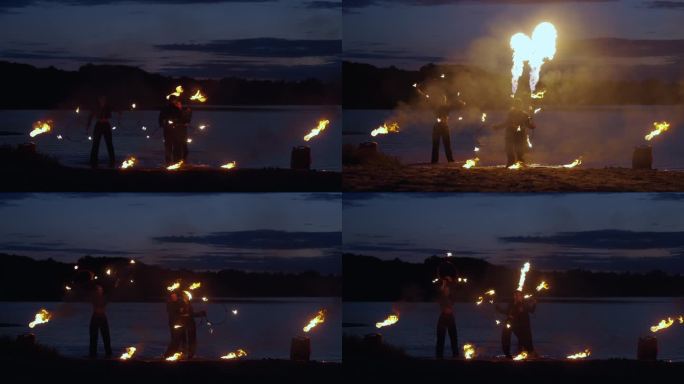 夏夜，马戏艺人在河滨表演火焰表演，用火焰表演惊人的戏法