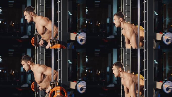 肌肉健壮的白人男子在运动俱乐部用杠铃训练机锻炼