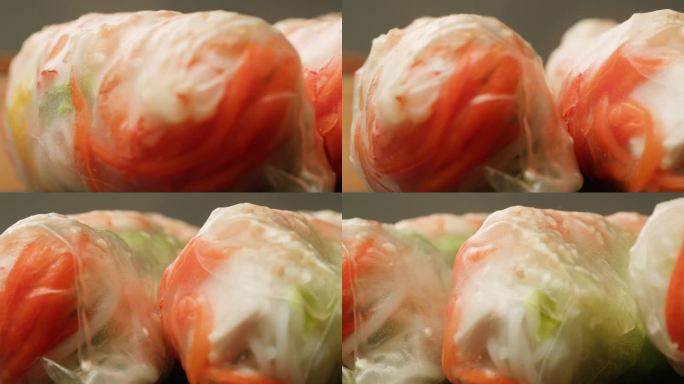 春卷里有虾和蔬菜的特写特写。米纸虾卷。烹调新鲜的越南春卷。健康食品。