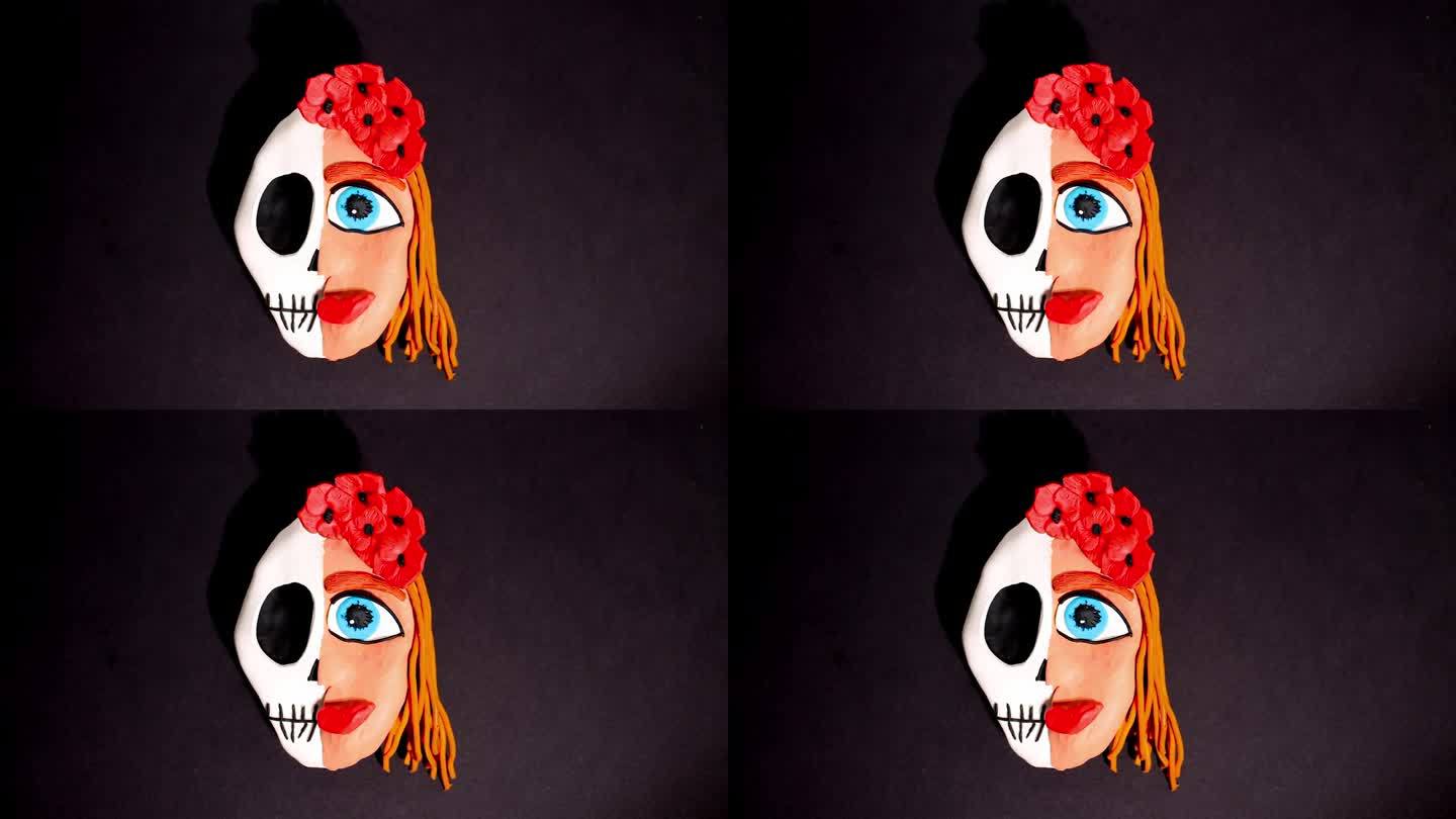 定格动画。一个女人的橡皮泥头被分成头骨，另一边是带着红色王冠的花头发。