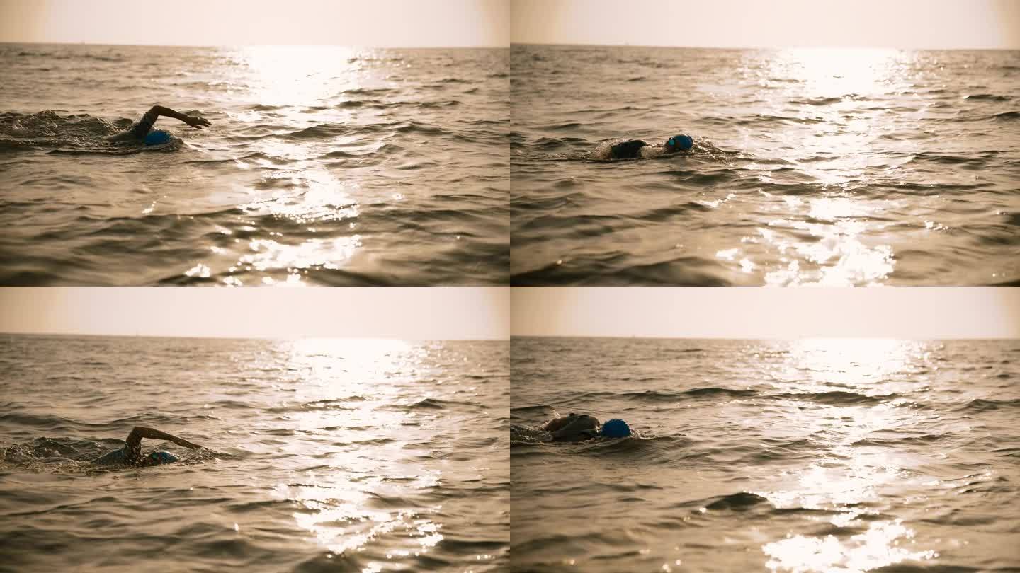 在日落时，女子在海景中对着天空游泳的镜头