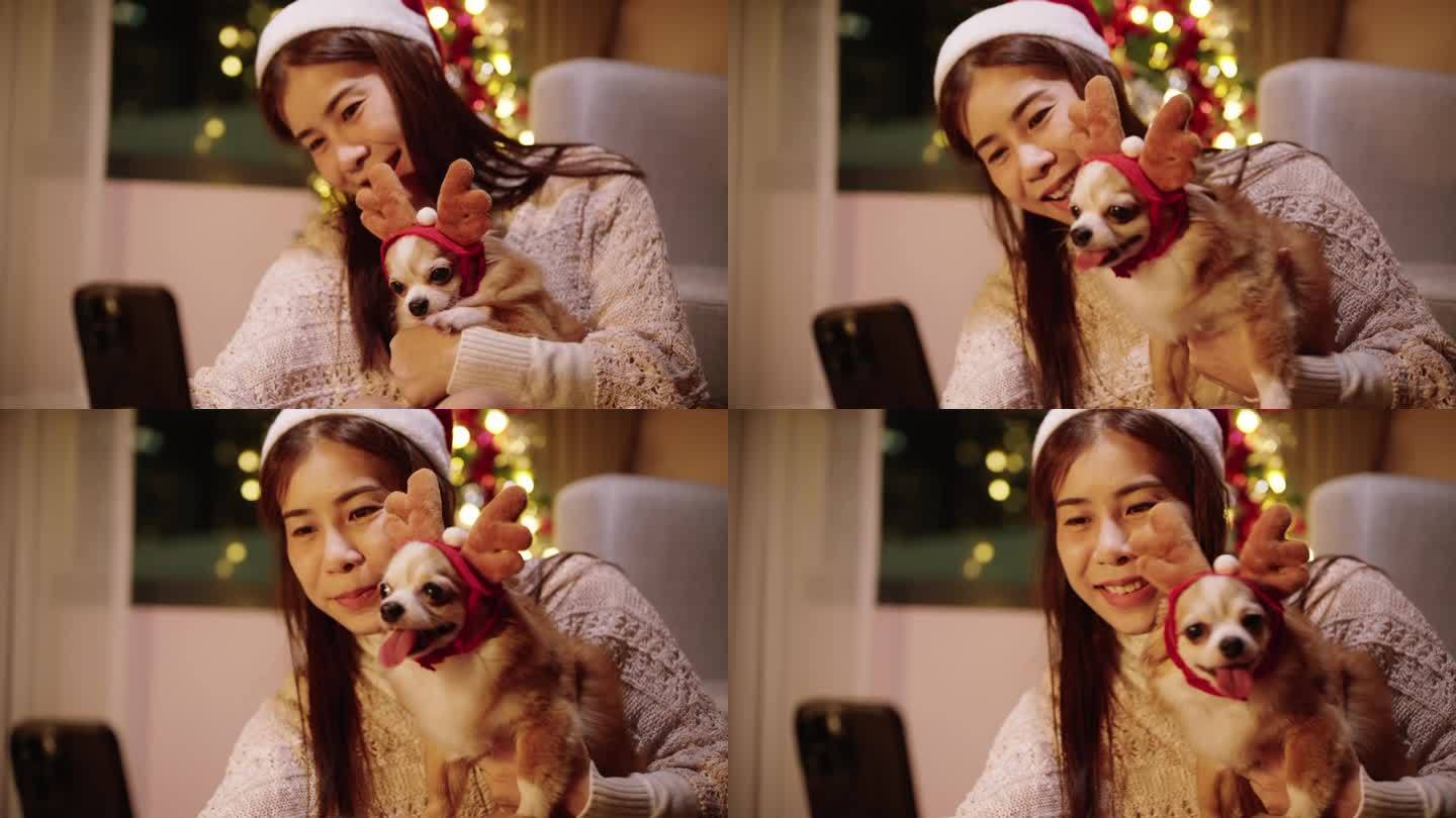 亚洲妇女玩和挠她的狗